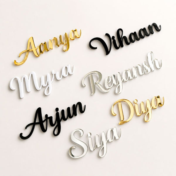 Decorative name pieces in various colors on a light background