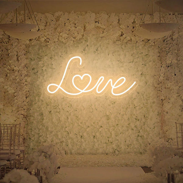 Warm white love neon sign giving cozy romantic light