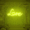 Yellow love neon sign adding warm glow to any space