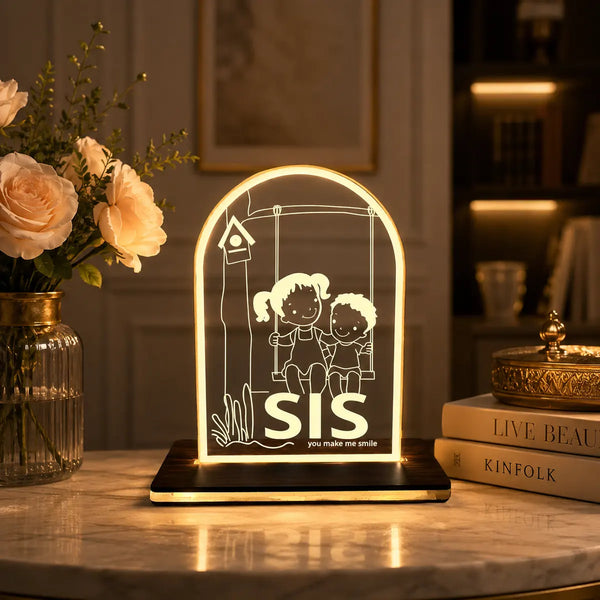 SIS swing acrylic LED table lamp in cozy warm home decor setting