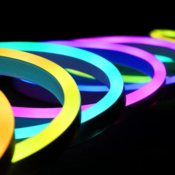 Neon glow strips in various colors on a black background