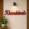 Custom Khandelwal's red wooden name plate for home entrance wall
