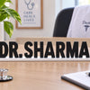 Custom doctor table name plate with black letters and white stand for clinic desk