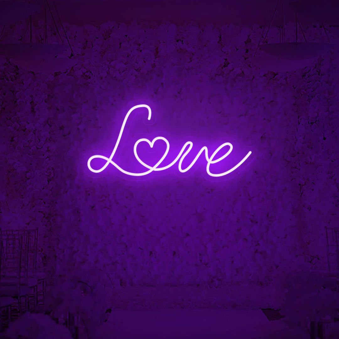 Purple love neon sign creating romantic ambiance