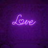 Purple love neon sign creating romantic ambiance