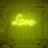 Yellow love neon sign adding warm glow to any space