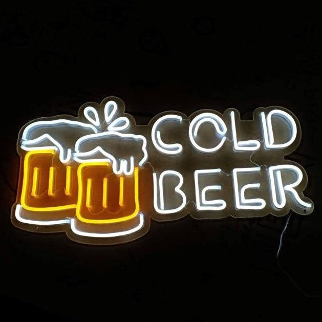 Neon sign with 'Cold Beer' text and beer mug graphics on a black background

