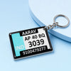 Personalized acrylic gel keychain with custom name and vehicle number plate design on blue background