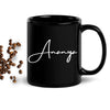 Personalized black ceramic mug with custom name printed in elegant script font.