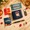 Rakhi Combo 04 personalized brother gift set with blue artistic photo print wallet, matching golden flakes pen, metal keychain, Rudraksha Rakhi, roli chawal bottles and Rakshabandhan cards