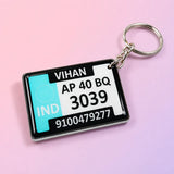 Waterproof personalized gel keychain with custom name and vehicle number plate design on pink background